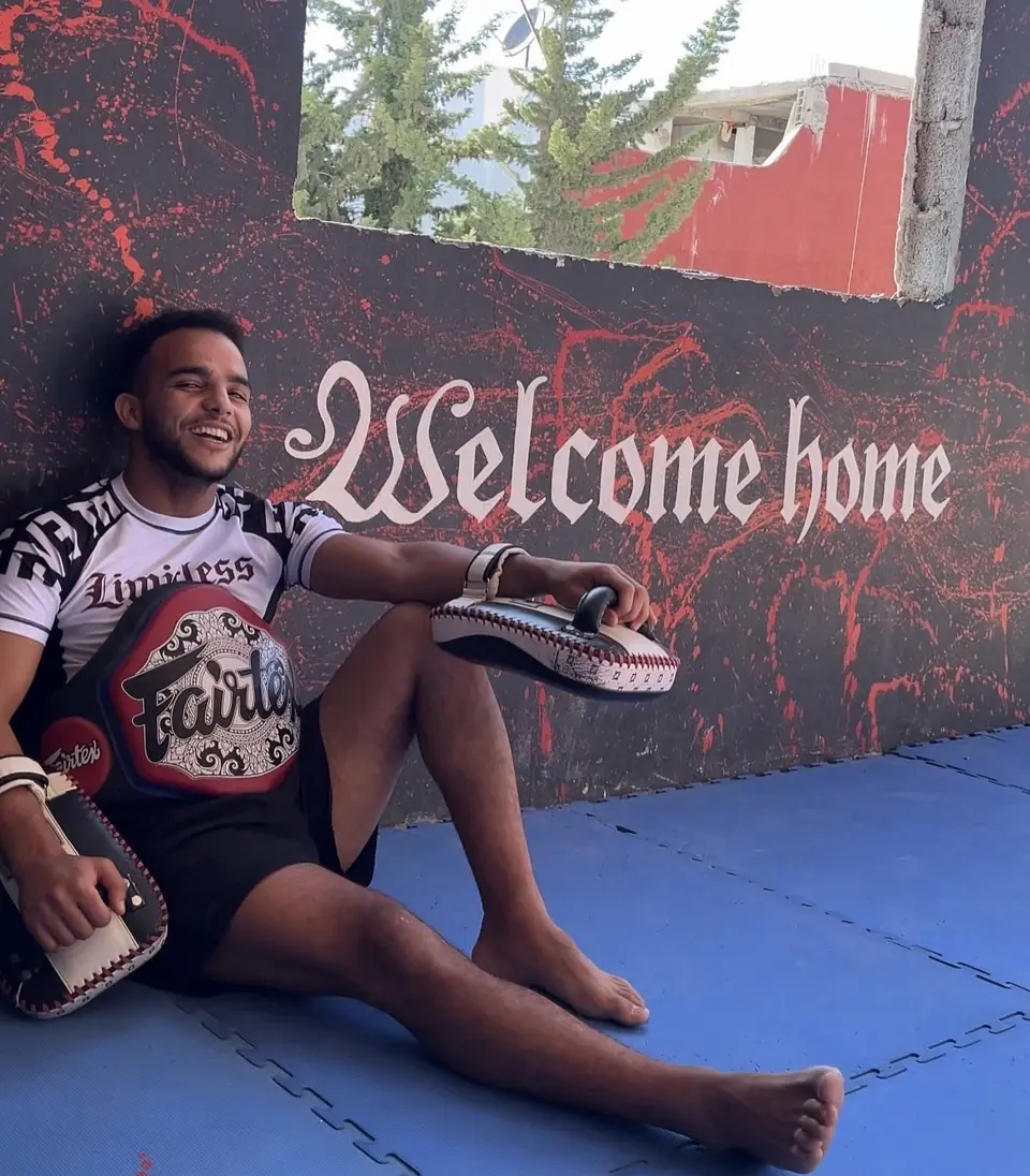 Coach Mo with Muay Thai pads