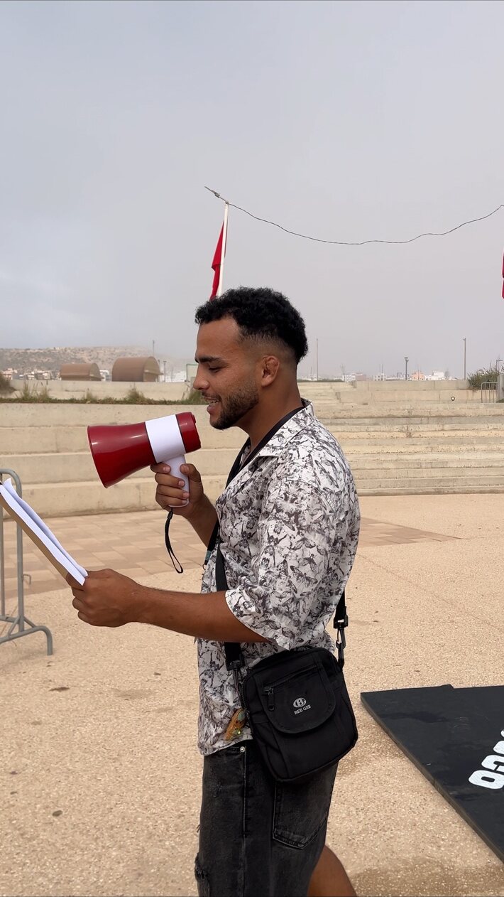 Event announcer speaking to the crowd
