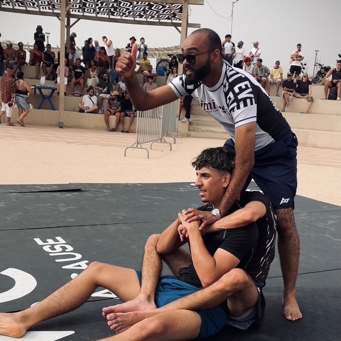 Coach supporting an athlete after a match